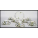 A 20th century Art Deco Bone China part tea service by Heathcote China having hand painted flower