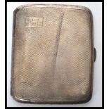 An early 20th century 1920's silver hallmarked cigarette case having an engine turned design.