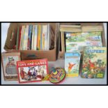 A large collection of vintage 20th century Rupert The Bear annuals dating from the 1950's along with