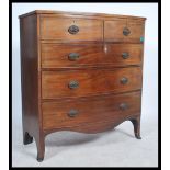 A Victorian 19th century mahogany bow front chest of drawers being raised on kick legs with 2