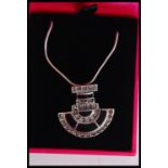 A silver and marcasite art deco style pendant necklace set with onyx complete in presentation