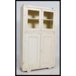 A vintage mid 20th century painted kitchen unit / cupboard, two glazed ( no glass ) doors to the top