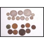 A group of vintage bank notes and silver coins dating from the 18th century. Coins to include George