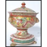 A 19th century Chinese / Canton famille rose decorated tureen with lid. Raised on paw feet with a
