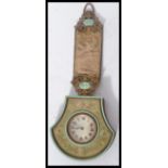 A 19th century Austrian tapestry and brass hanging carriage / sedan chair clock of axe head form.