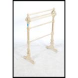 A Victorian 19th century painted ecclesiastical towel rail of unusual shape with canted uprights