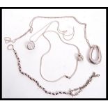A dealers lot of silver to include long silver necklace of ball form with abstract lozenge