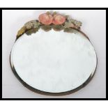 A 19th century Victorian Barbola mirror of circular form. The bevelled glass mirror having a