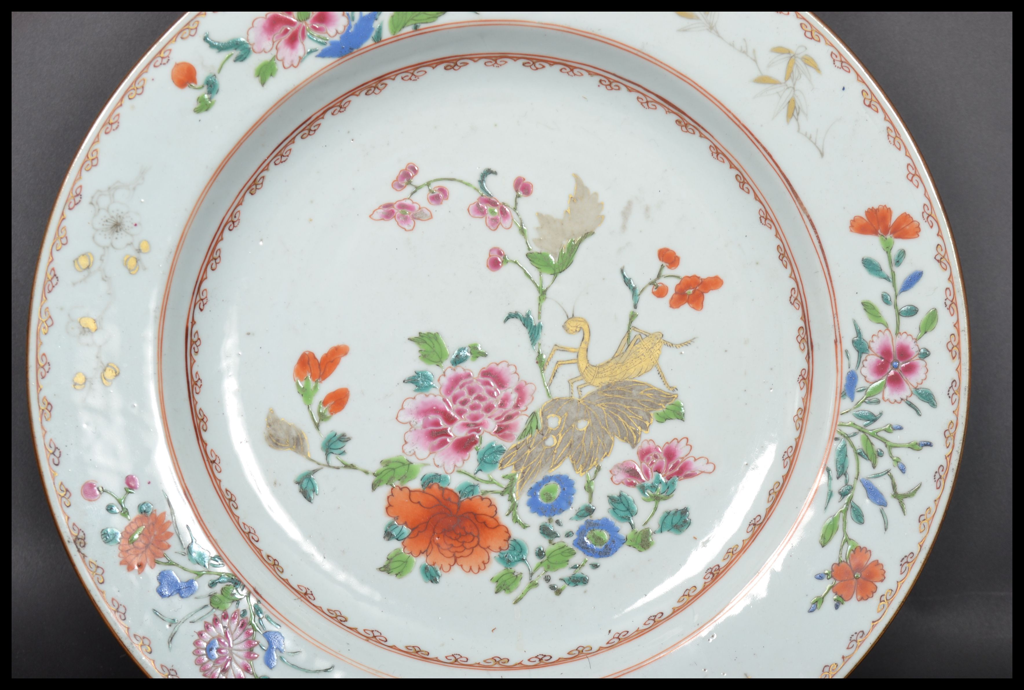 An 18th century Chinese Qing Long Famille Rose plate hand painted with enamels depicting floral - Image 2 of 8