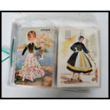 KITSCH postcards. Collection (41) of Embroidered costume cards mostly Spanish ladies.Despite the