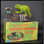 A 20th century retro novelty advertising Karma Chameleon telephone. Moving Chameleon figure,