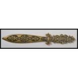 A 19th century French bronze brass paper knife letter opener having a pierced and scrolled