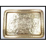 A 19th century Indian Raj period brass tray of rectangular form having geometric patterns with a