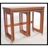 A retro teak wood 20th century McIntosh of Kirkcaldy Triform teak trolley nest of tables having a