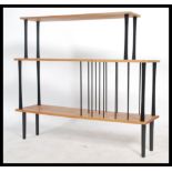 A retro 20th century music entertainment floor standing shelving unit. The shelving unit having