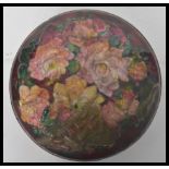 CAMILLE FAURE (1874-1956) A lidded pot enamelled with a band of flowers in colours, signed C.