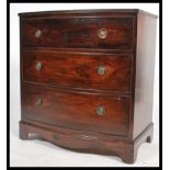 A Georgian style Regency revival bow fronted bachelors mahogany chest of drawers. The bank of