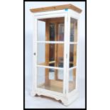 A 20th century up - cycled pine and glass display cabinet, double doors to the front fitted with