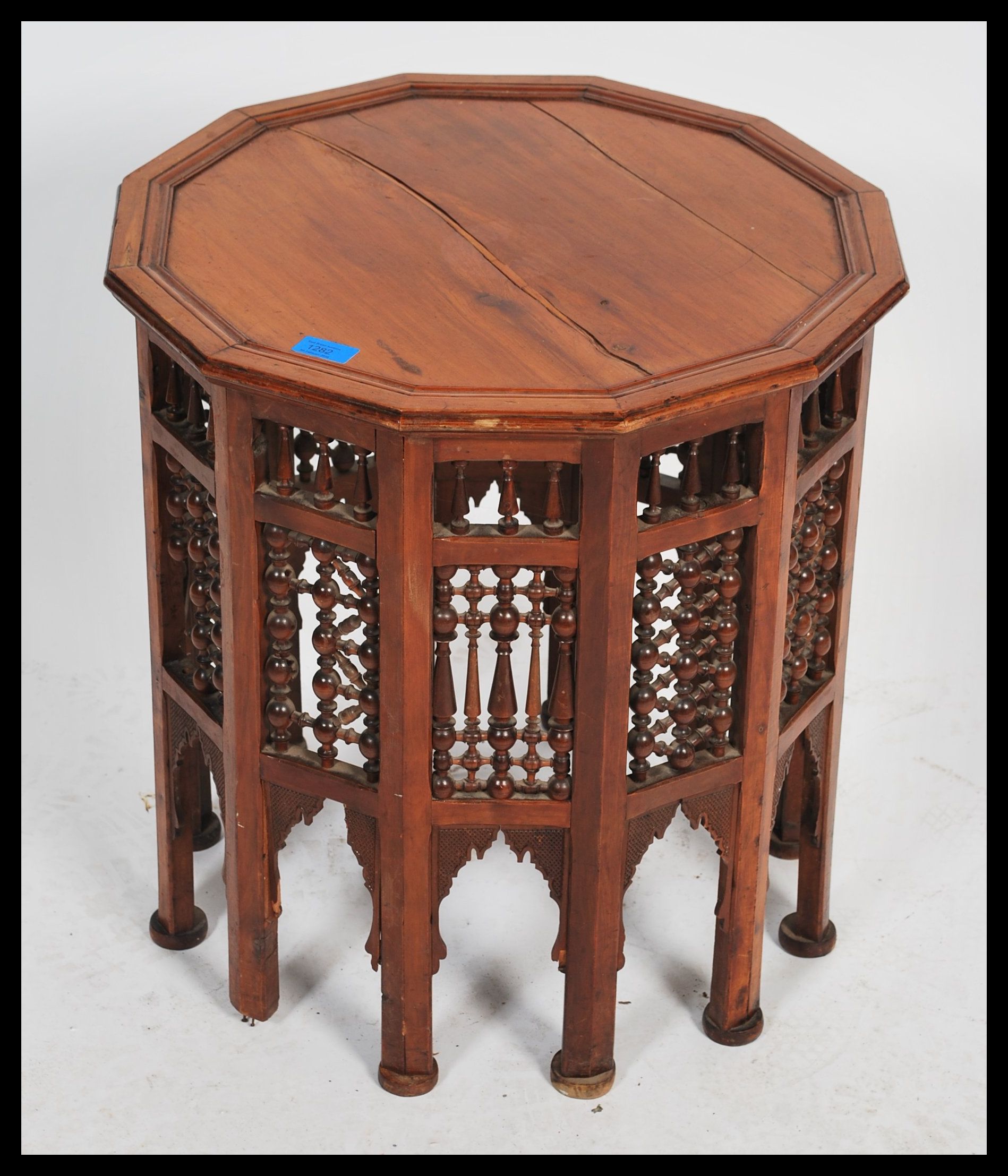 A Moroccan wooden occasional wine table having twelve sides. The dodecagonal top supported by 12 - Image 2 of 4