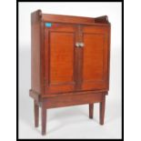 A 19th century Victorian shelved cabinet cupboard having a gallery back. Raised on square legs