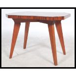 A vintage 20th century 1930s coffee / occasional table raised on splayed tapering legs with a