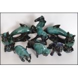 A collection of 20th century Blue Mountain pottery figurines to include Buffalo, owl, dolphins,