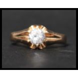 A hallmarked 9ct gold and white stone ring. Hallmarked for London. Weight 3.3g. Size T.