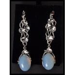 A pair of silver and moonstone drop earrings complete in presentation box.