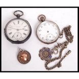Two vintage early 20th century pocket watches along with a silver hallmarked albert chain and two