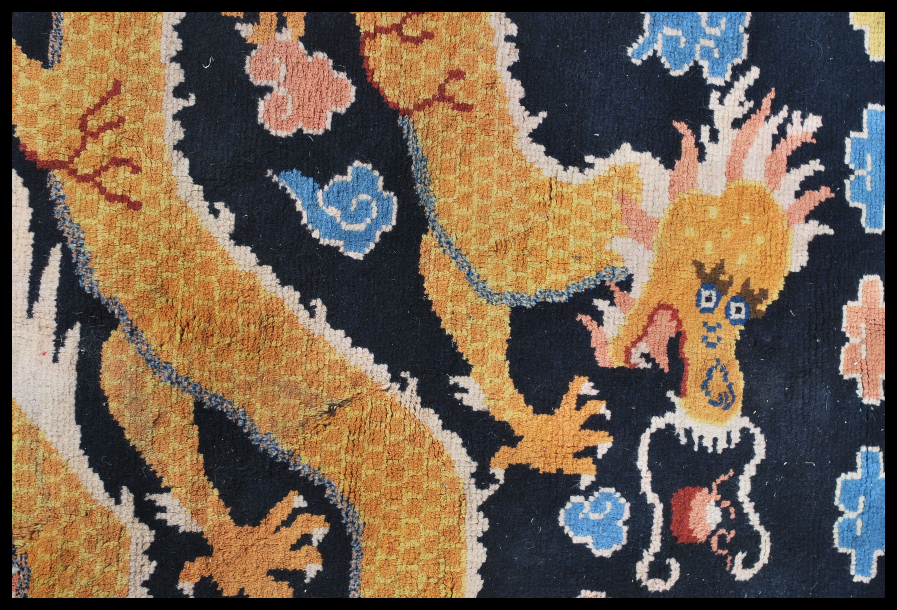 An early 20th century Tibetan dragon rug. The blue ground with large continuous dragon with - Image 2 of 6