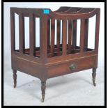 A 19th century Victorian mahogany three section Canterbury with single drawer on turned legs to