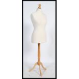 Vintage 20th century dress makers dummy raised on a tripod base stand.The bust is approx 97cm, the