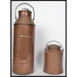 A large early 20th century agricultural copper and brass dairy milk churn with looped swing handle