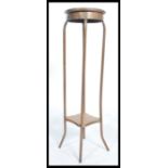 A vintage retro torchere plant stand comprising of shaped copper piping and plywood plinths together