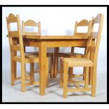 A good quality solid oak draw leaf extending dining table raised on squared legs with solid oak
