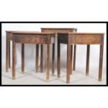 A set of four vintage early 20th century school desks, each with hinged slope enclosing storage,