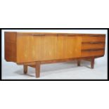 A retro 20th century teak wood long sideboard fitted with a run of three drawers and a series of