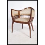 An Edwardian mahogany marquetry inlaid salon chair. Raised on shaped frame with railed back splat