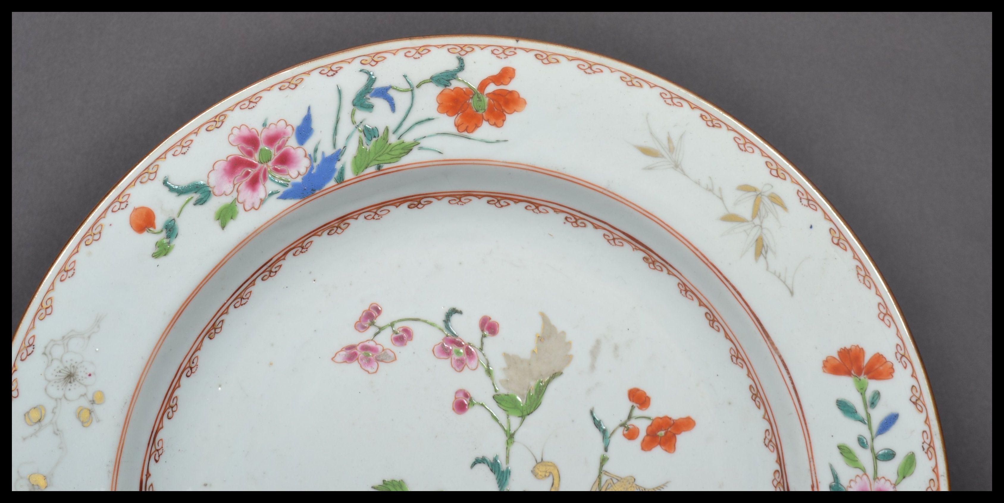 An 18th century Chinese Qing Long Famille Rose plate hand painted with enamels depicting floral - Image 3 of 8
