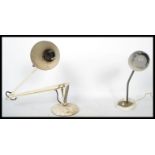 Two vintage 20th century retro industrial lamps one being a white mid century anglepoise and the