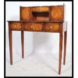 A Regency revival mahogany ladies writing table desk - bonheur de jour being raised on turned legs