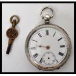 A Continental silver pocket watch having an enamel face with Roman numeral chapter rings and faceted