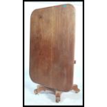 A 19th century mahogany rectangular tilt top  breakfast table on tapered floral carved stem and