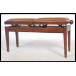 A contemporary mahogany adjustable duet piano stool. The double stool with adjustable seat