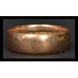 A gentleman's large 9ct gold band ring of usual form weighing 7.7g