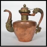 A 19th century Tibetan copper and silver mounted coffee pot kettle / ewer with dragon handle and