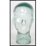 A 20th century moulded pressed glass phrenology type head - shop display stand / millinery mannequin