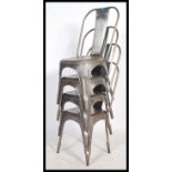 A set of four industrial Tolix style metal stacking cafe chairs. Each chair with a tapering splat