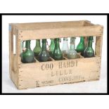 A vintage 20th century Industrial wooden crate of bottles being complete. The box with original