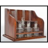 A stunning mid 20th century mahogany chemists fully appointed test tube stand with an arrangement of